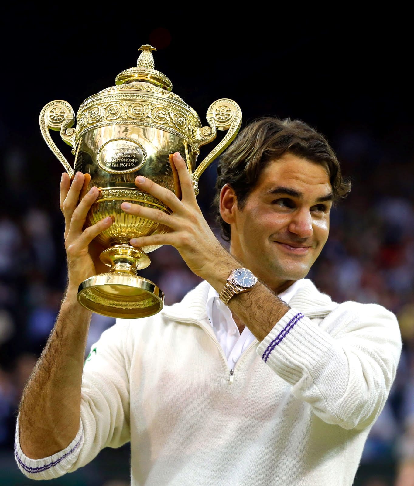 Roger Federer holding trophy sporting Rolex Datejust II 
