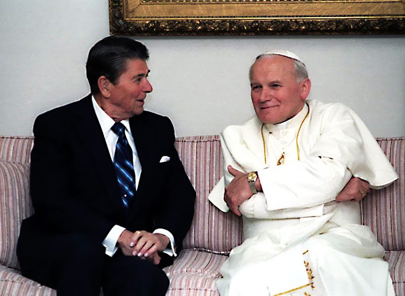 Pope John Paul II sitting with Ronald Reagan 