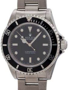 A picture of a rolex submariner with a black dial 