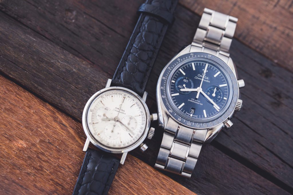 An image of a vintage Seamaster chronograph and a modern Speedmaster 