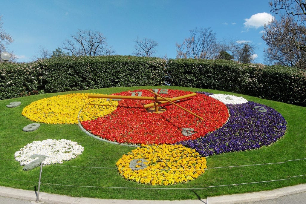 A working clock and floral display in Geneva, photo credit: Flickr