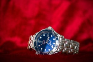 OMEGA Seamaster 300m Co-Axial 212.30.41.20.03.001 on red background