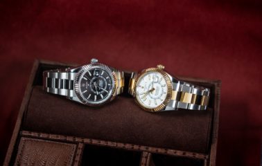 A pair of Rolex Sk-Dwellers on their sides